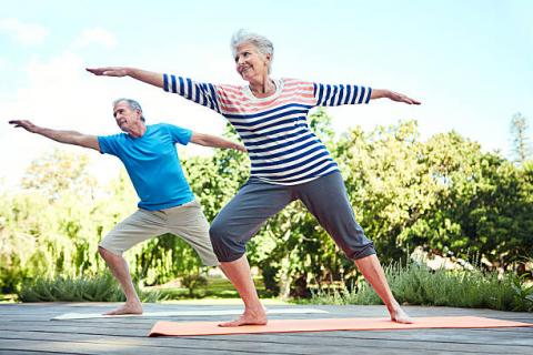 Elderly people doing yoga